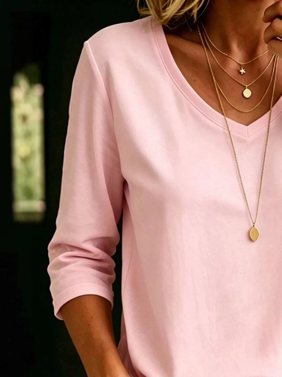 Plus size V-neck T-shirt with 3/4 sleeves from Trendsi, showcasing a comfortable, full-size top in a relaxed fit.