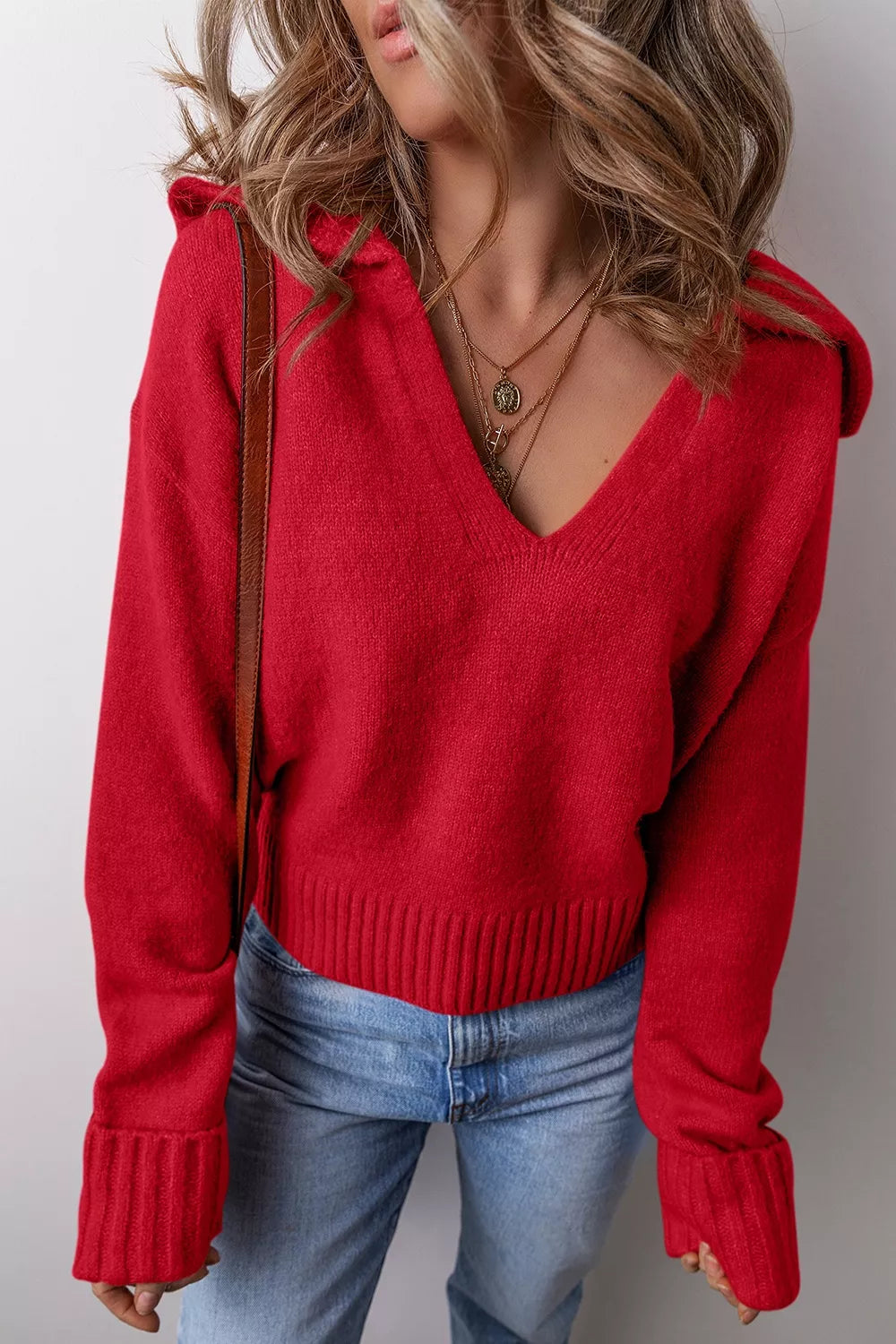 Women's ribbed hem long sleeve sweater by Trendsi, showcasing a cozy knit design with a fitted silhouette and ribbed details.