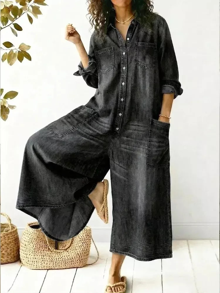 Plus size Trendsi jumpsuit with full button front, wide leg design, and chest pockets, shown on a model.