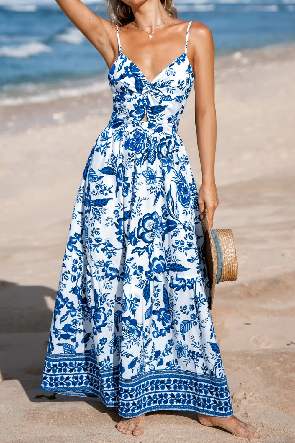 Floral print twisted front backless maxi dress from Plush Fashion Hub showing a fitted bodice and flowing skirt.