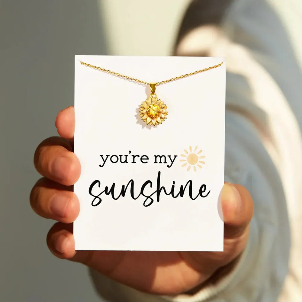 Gold-plated sunflower pendant necklace with floral design, featuring a 18K gold finish, from Plush Fashion Hub.