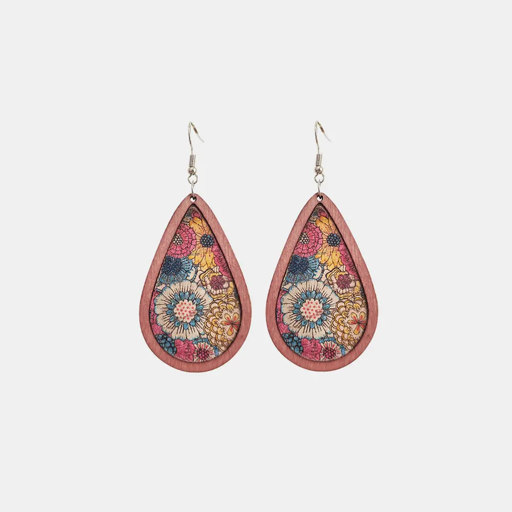 Wood teardrop earrings with floral design from Plush Fashion Hub, showcasing detailed craftsmanship and natural wood texture.