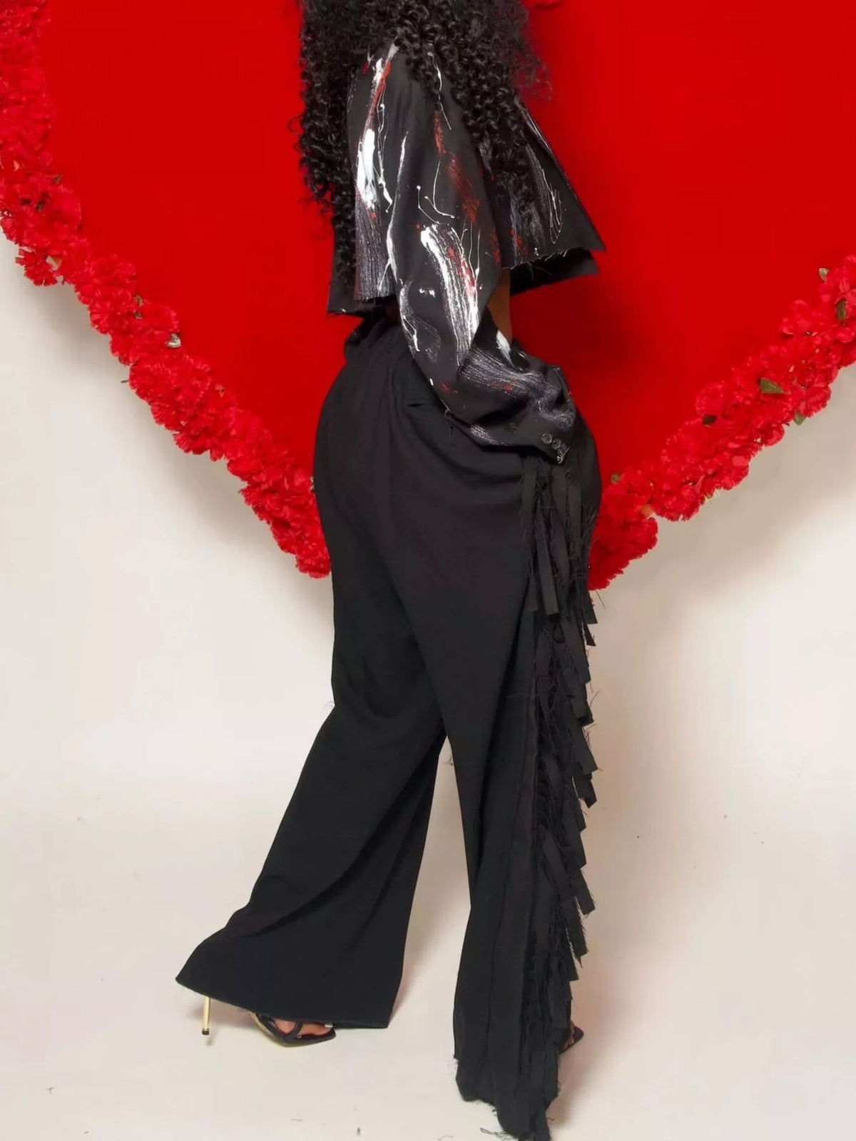 Wide-leg women's pants with fringed details by Trendsi, featuring flowing fabric and stylish design perfect for casual or dressy looks.