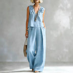 Women's sleeveless cotton-linen shirt and pants set by FitiqueFit, casualwear, laid out flat showing the light, breathable fabric and relaxed fit.