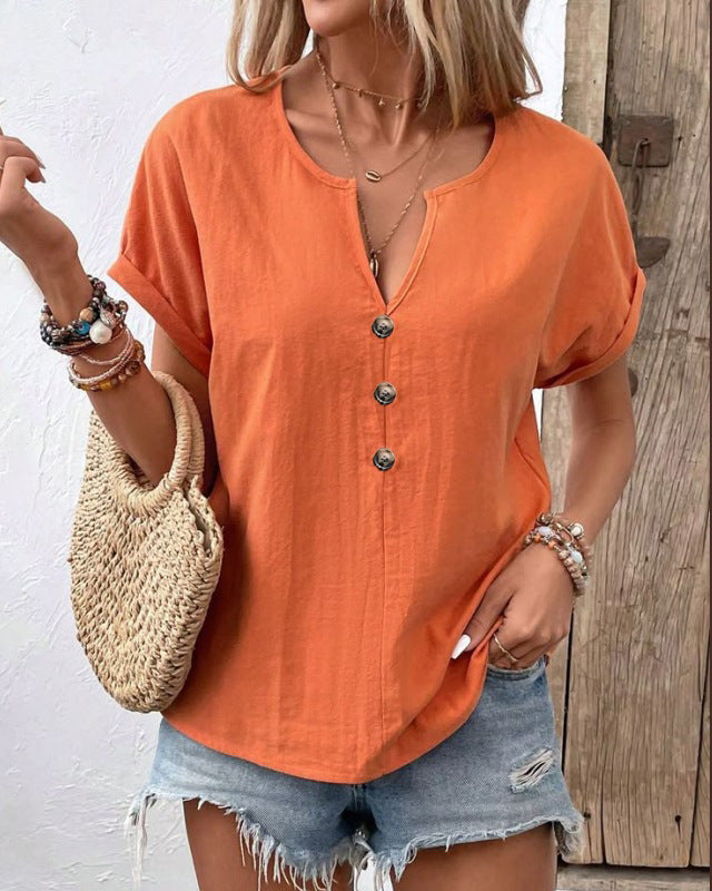 Women's short-sleeve V-neck T-shirt top with button details, in a casual style, featuring a fitted cut and soft fabric.