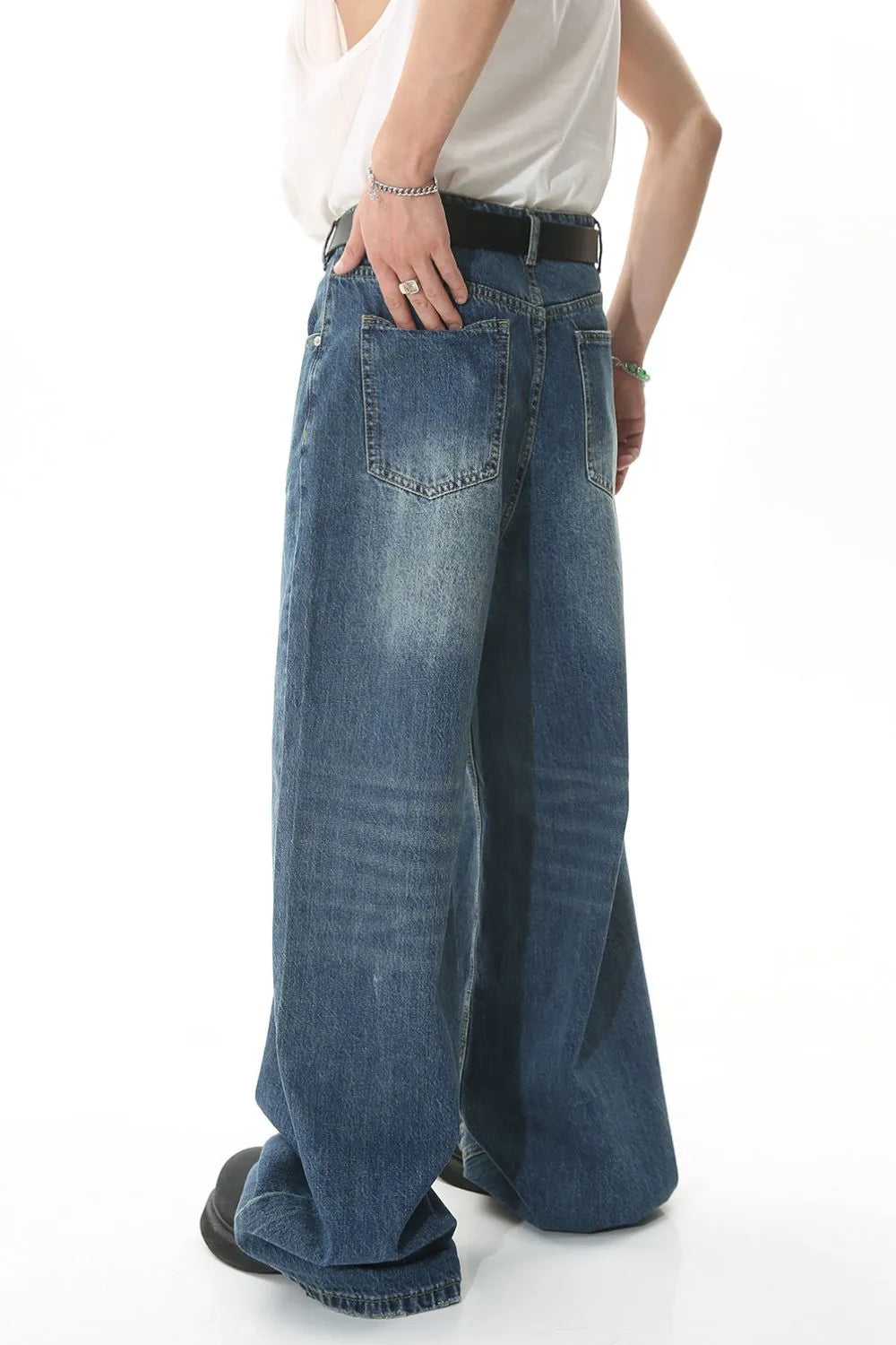 Wide leg jeans with pockets from Trendsi, showing a relaxed fit and classic denim style on a model.