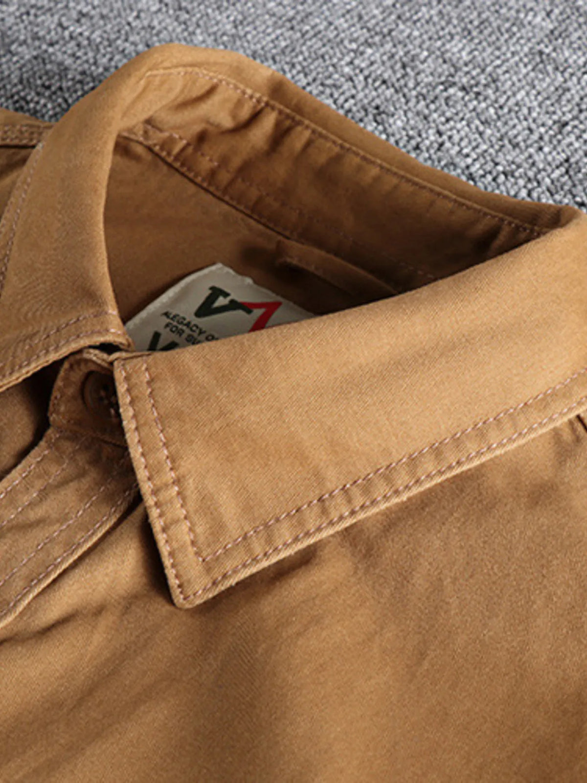 Men's plus size button-up shirt with chest pockets from Trendsi, featuring a classic design and comfortable fit.