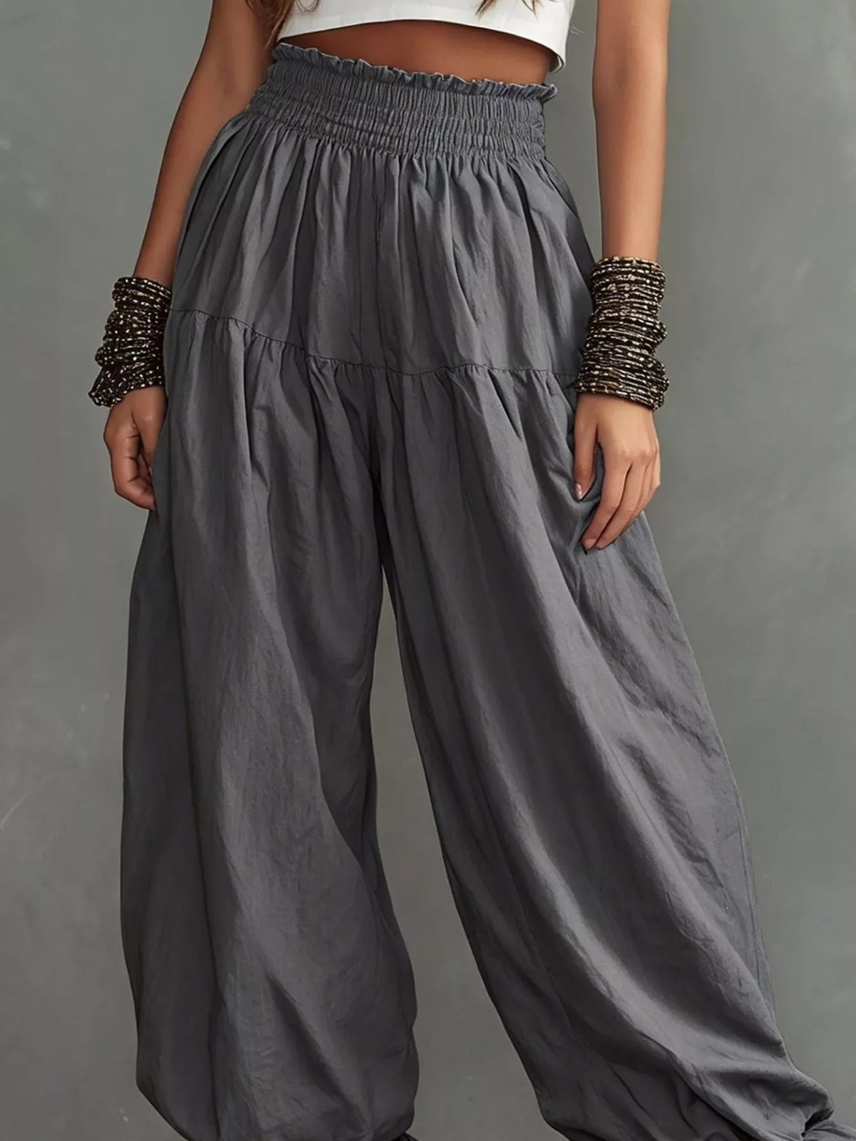 Plus size full smocked ruffle hem wide-leg pants from Plush Fashion Hub, showing the flowy fabric and ruffle detail.