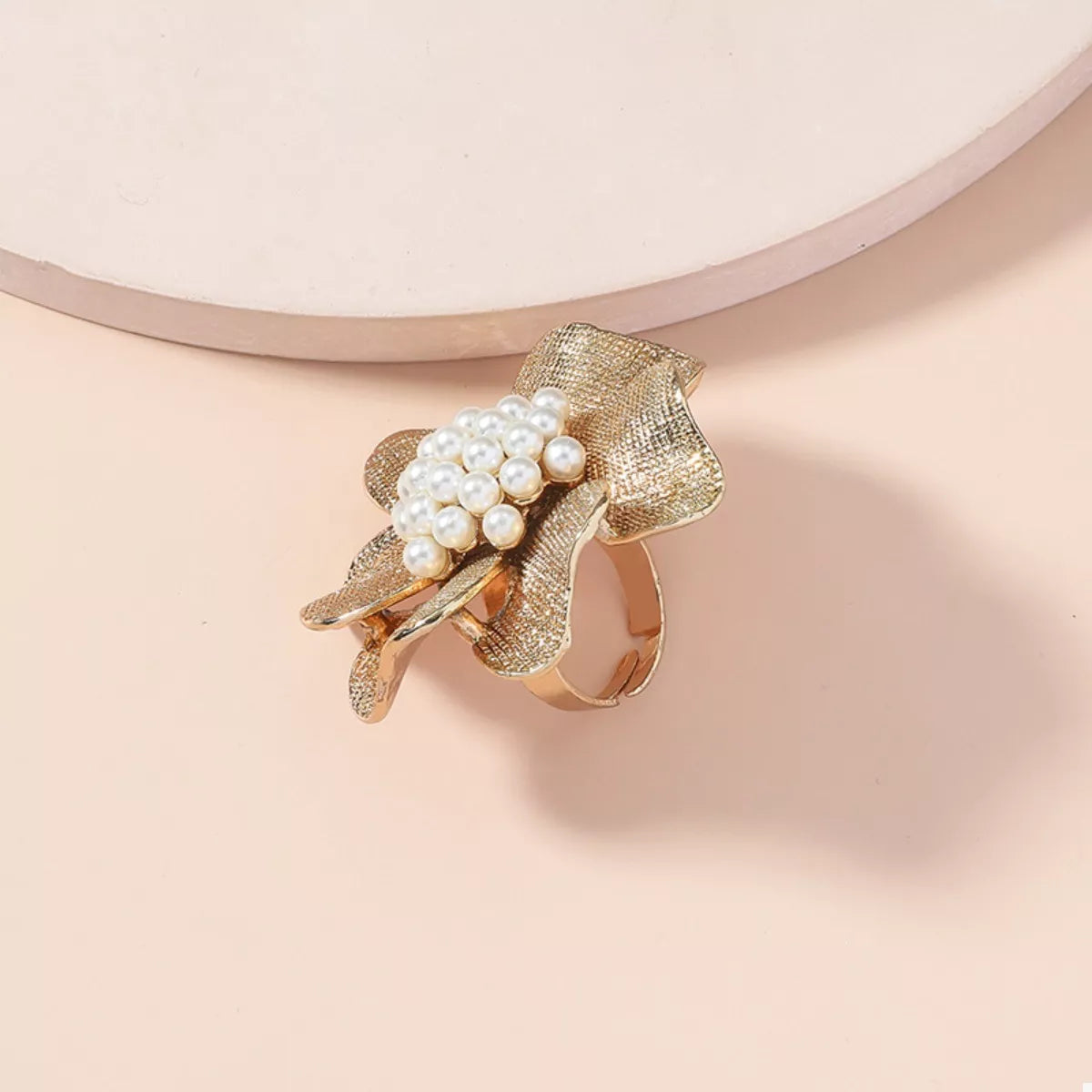 18K gold-plated pearl flower ring with delicate floral design, showcasing elegant jewelry craftsmanship.