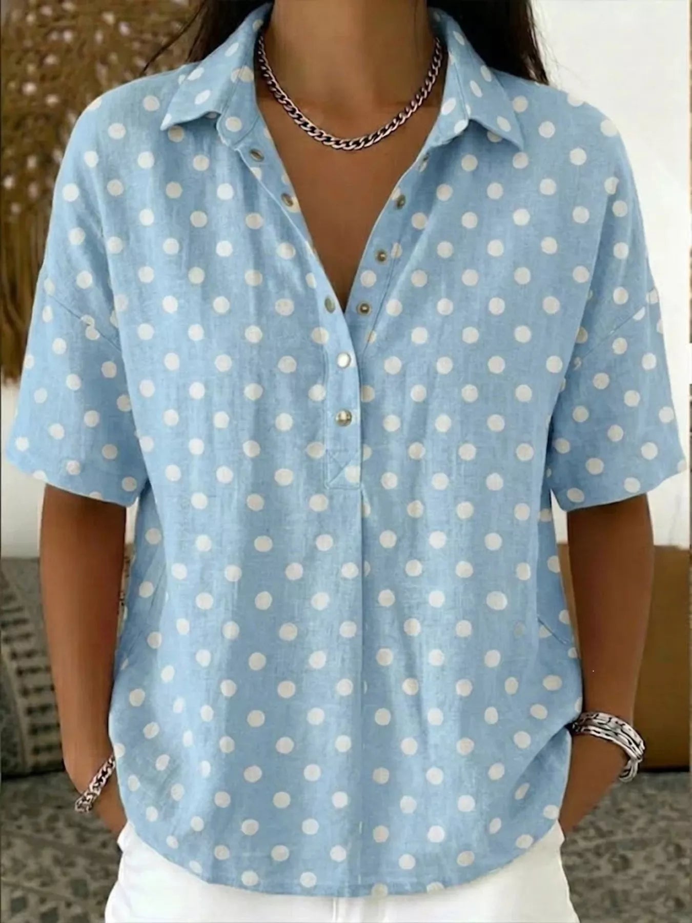 Plus size polka dot short sleeve shirt from Trendsi, stylish full-size top with a classic polka dot pattern and comfortable fit.