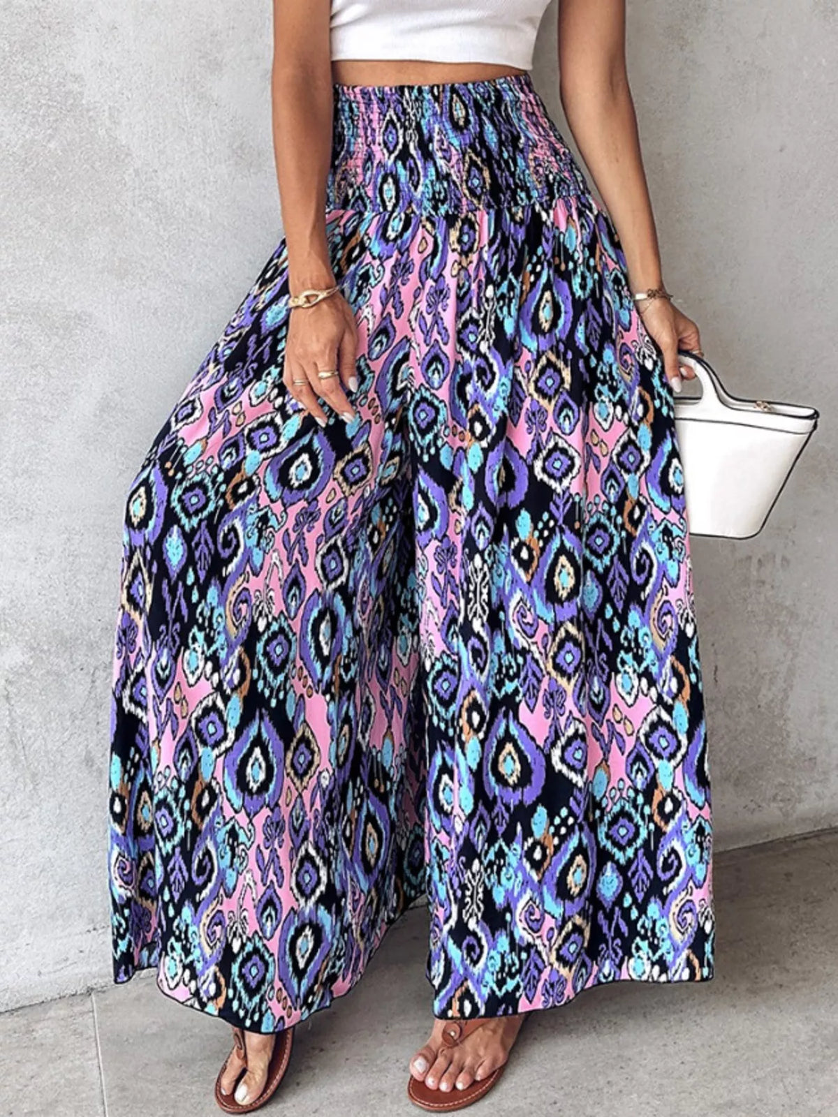 Printed wide-leg pants from Plush Fashion Hub featuring vibrant floral patterns and flowing fabric.