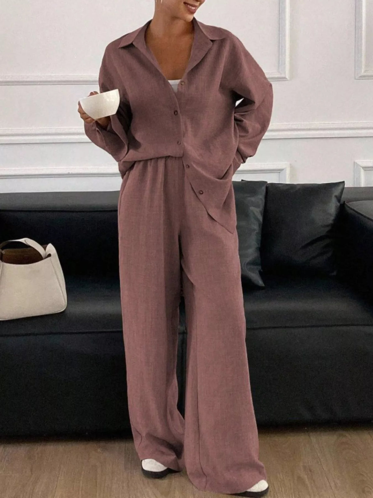 Trendsi long sleeve button-up shirt and wide-leg pants set, shown in a coordinated stylish outfit on a model.