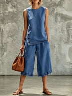 Women's tank top and wide-leg pants set with side split, pockets, and buttons from Plush Fashion Hub, shown on a model.