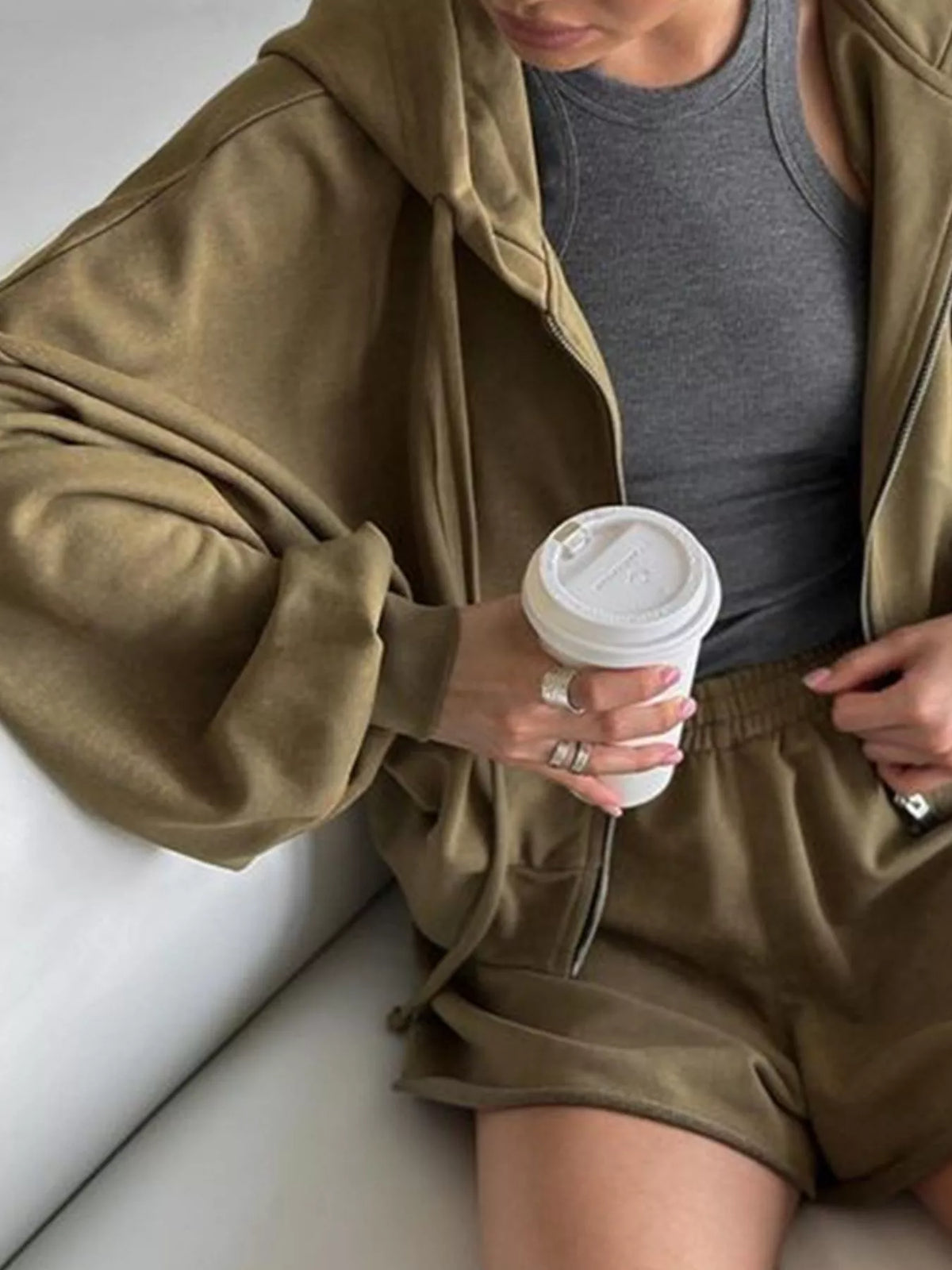 Plush Fashion Hub zip-up long sleeve outerwear with matching shorts set, featuring a stylish and comfortable casual outfit.