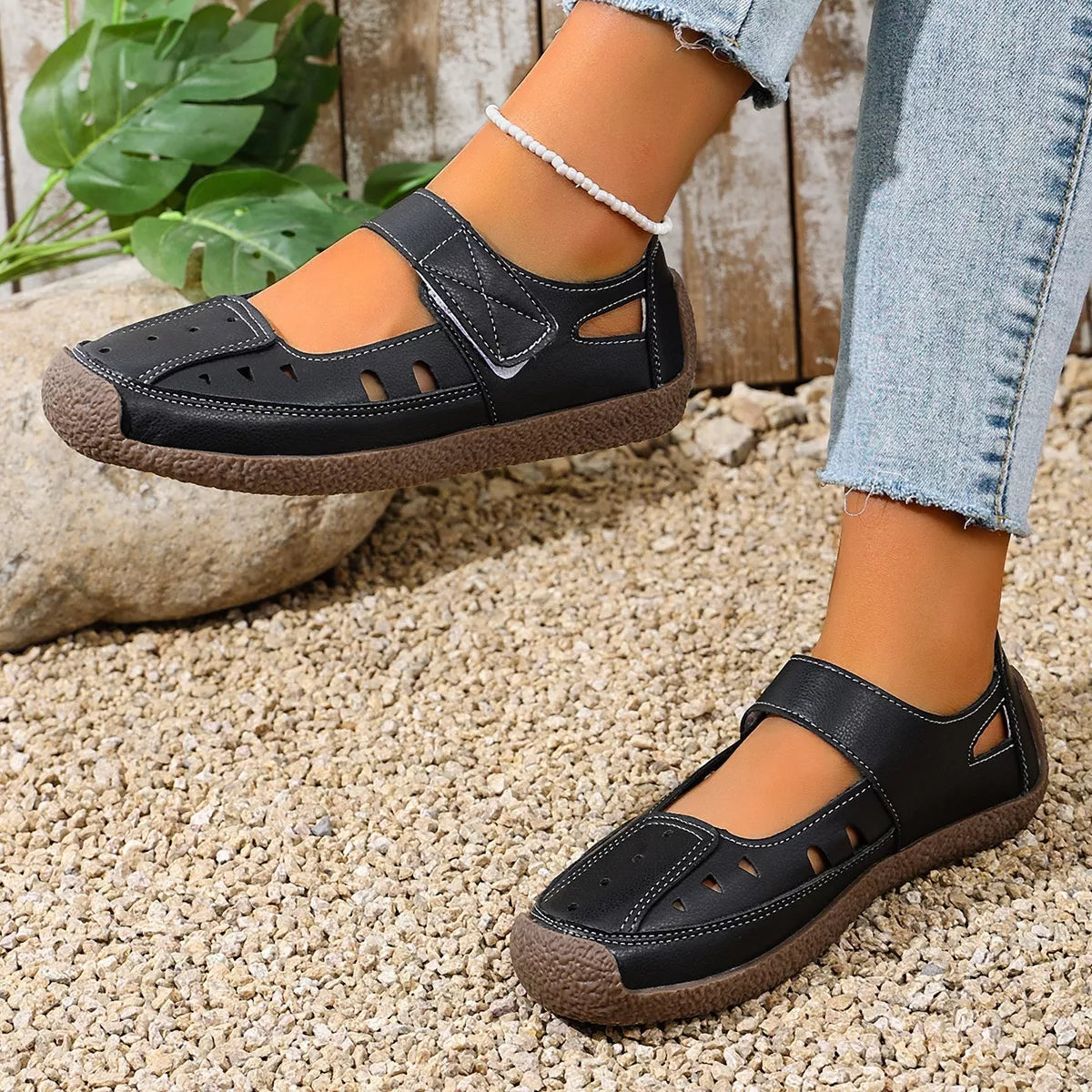 Trendsi round toe platform slip-on footwear with a sleek design and comfortable fit, featuring a smooth upper and chunky sole.
