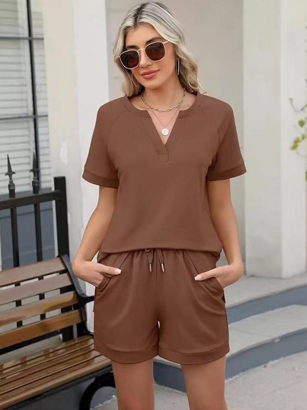 Solid color short sleeve top and shorts two-piece set by Plush Fashion Hub, casual lightweight summer apparel.
