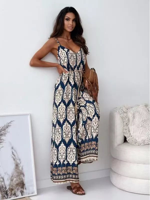 Printed spaghetti strap wide-leg jumpsuit by Plush Fashion Hub featuring a stylish design and comfortable fit.
