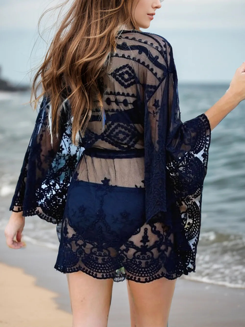 Lace V-neck three-quarter sleeve cover-up dress by Plush Fashion Hub, lightweight and elegant for stylish beach or casual wear.