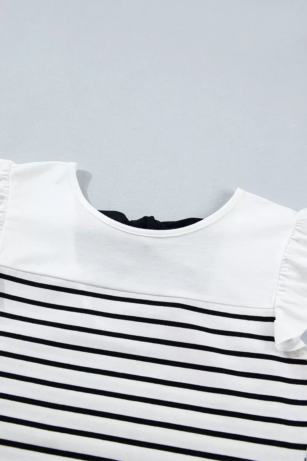 Plush Fashion Hub stripe contrast knot back ruffle trim tank top featuring a stylish knot detail and feminine ruffle accents.