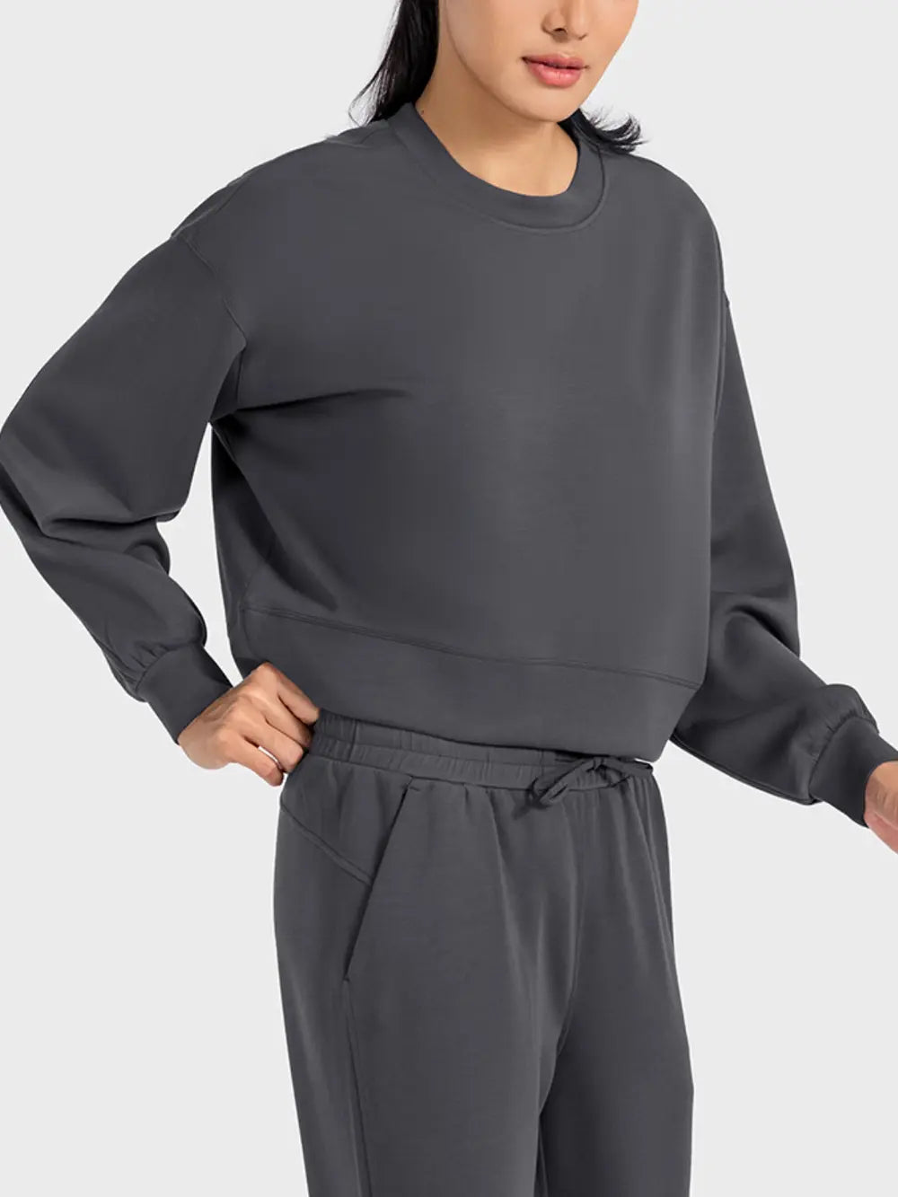 Plush Fashion Hub Millennia round neck drop shoulder sports top in soft fabric, designed for comfort and athletic style.