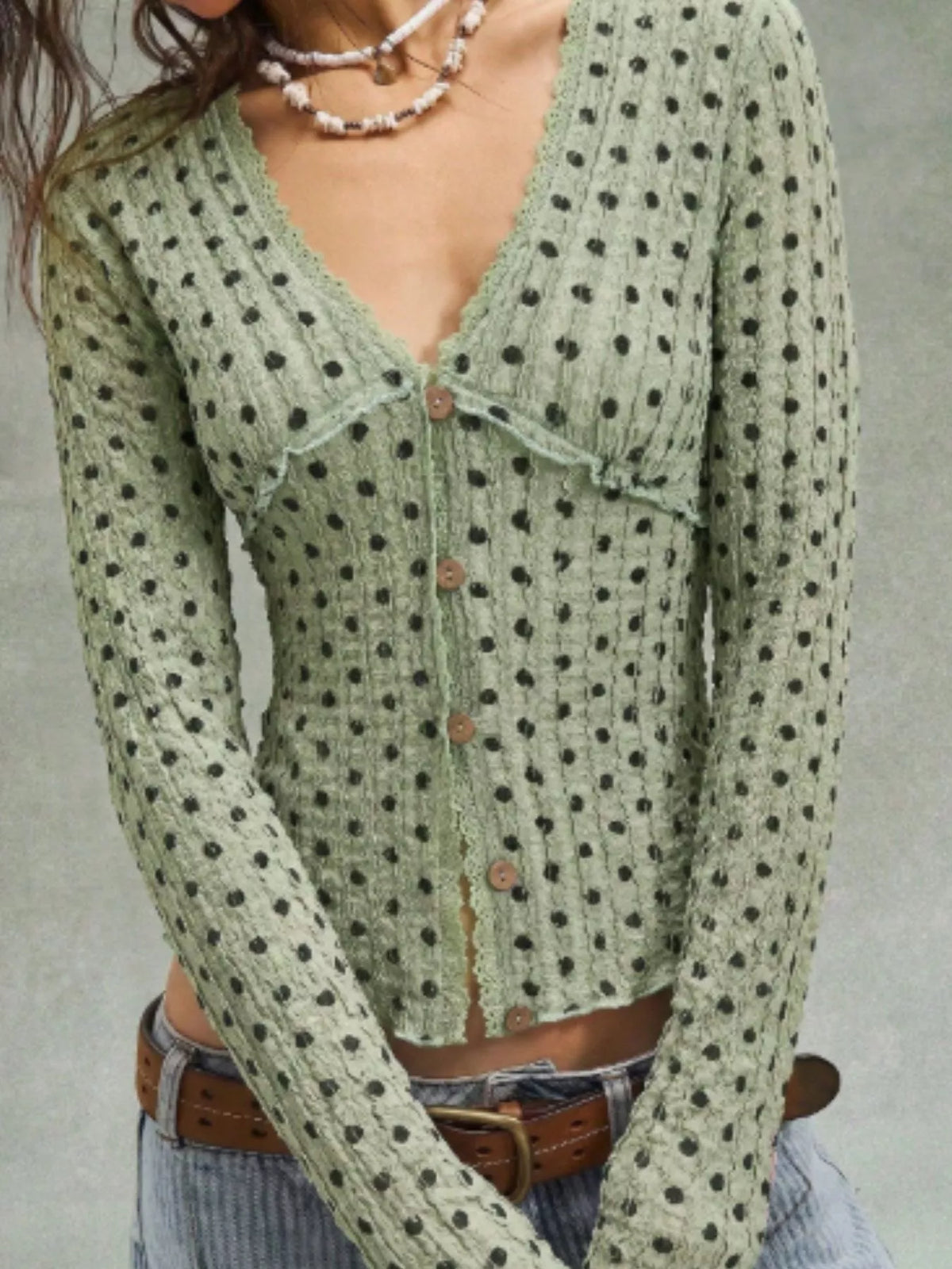 Women’s textured long sleeve button-down blouse with polka dot pattern, stylish and comfortable Trendsi fashion top.