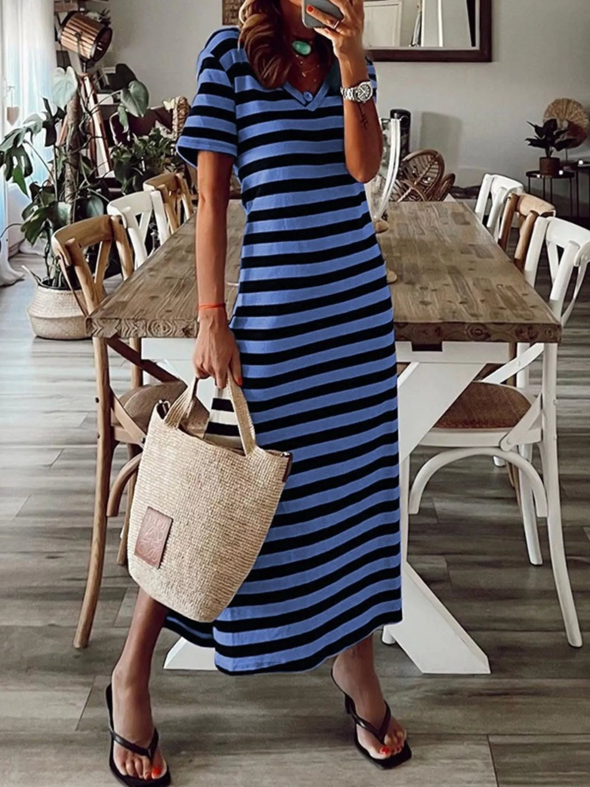 Plus size striped V-neck midi dress with side slit by Trendsi, featuring a stylish and comfortable design for casual wear.