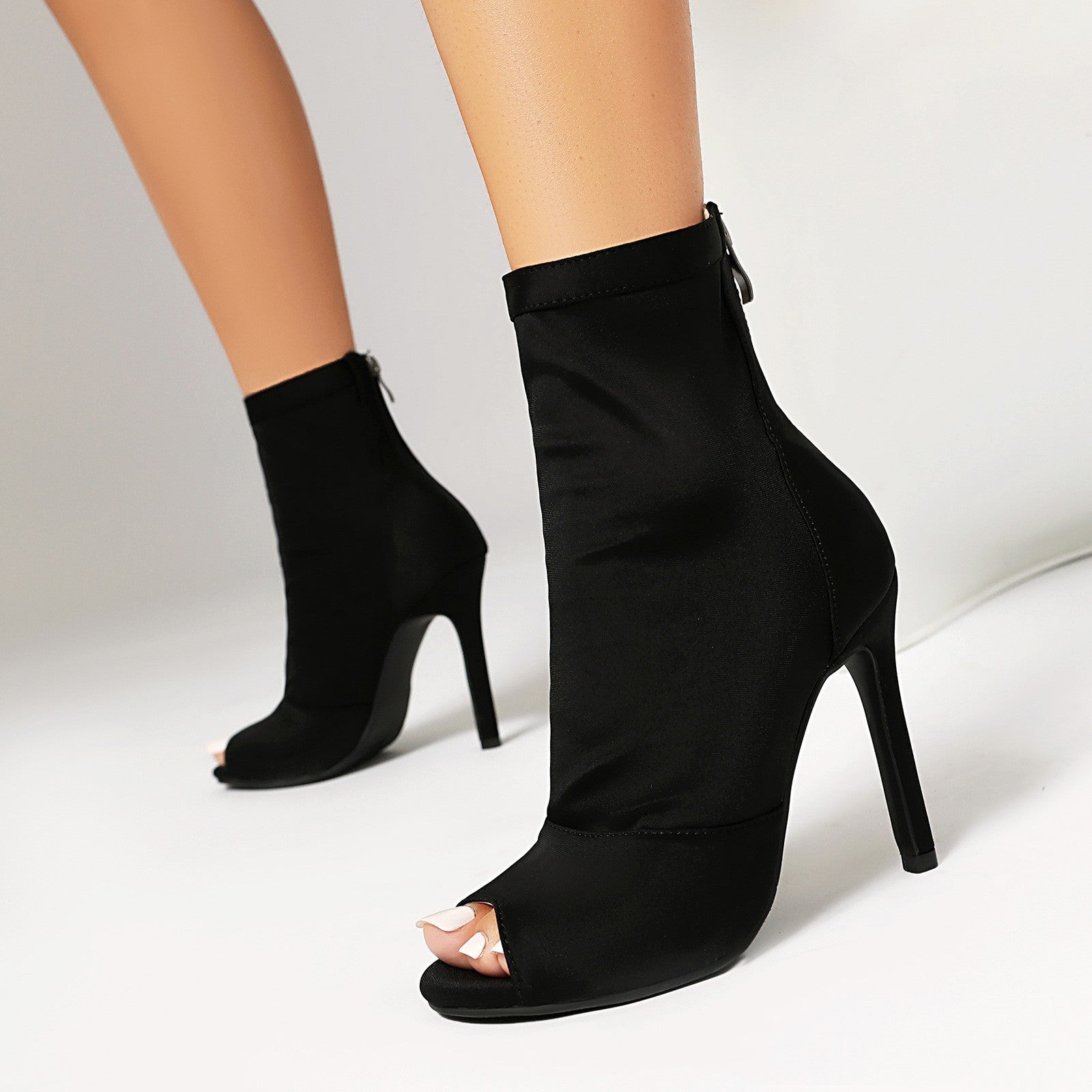 Women's black peep toe stiletto boots with fishmouth design from Plush Fashion Hub, showcasing high heels and stylish footwear details.