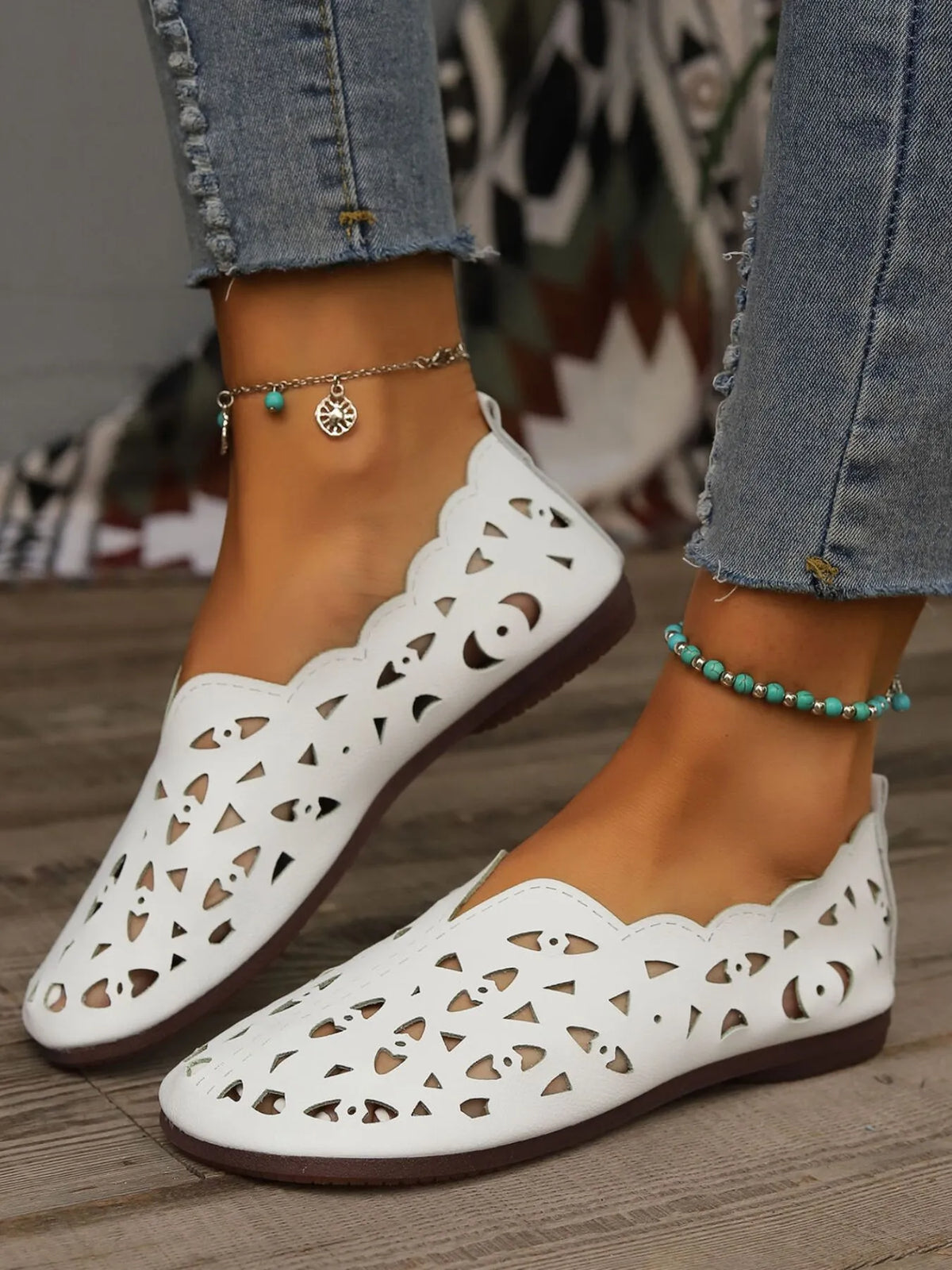 Perforated leather slip-on loafers by Trendsi, showcasing stylish design and breathable perforations in a close-up shot.