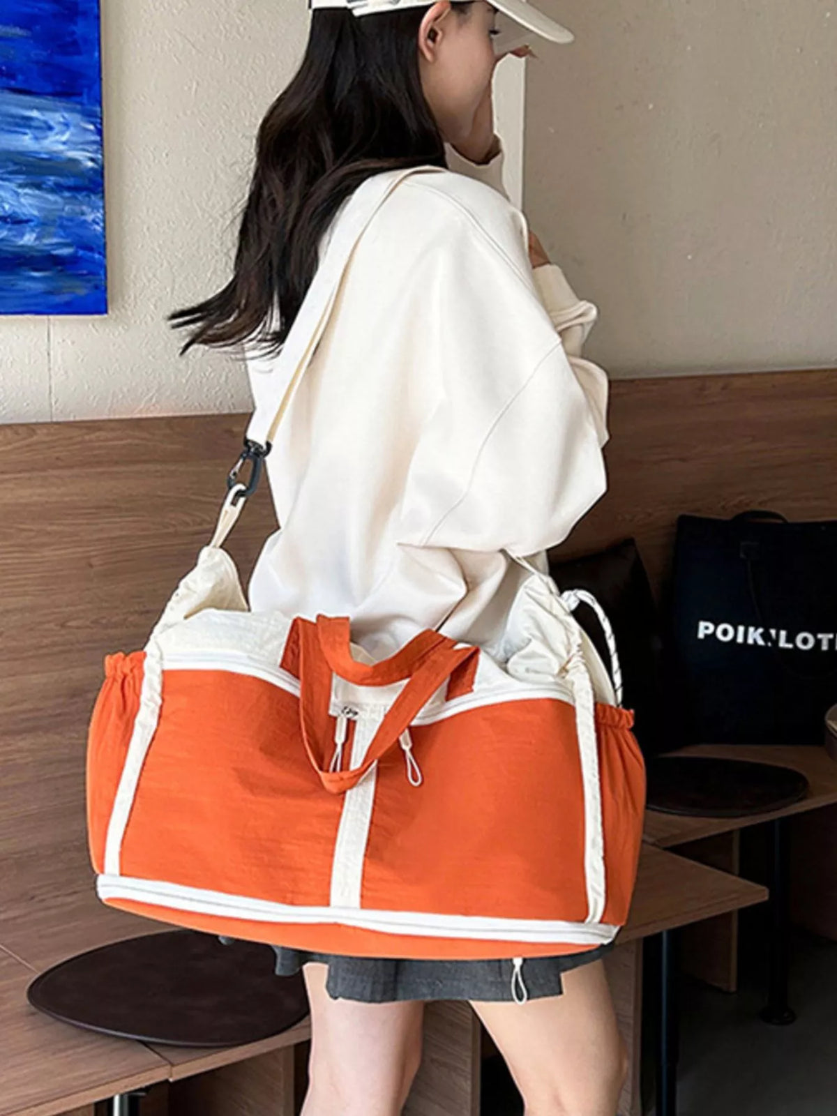Color-block travel bag by Plush Fashion Hub featuring multiple vibrant colors and a spacious design for easy packing.