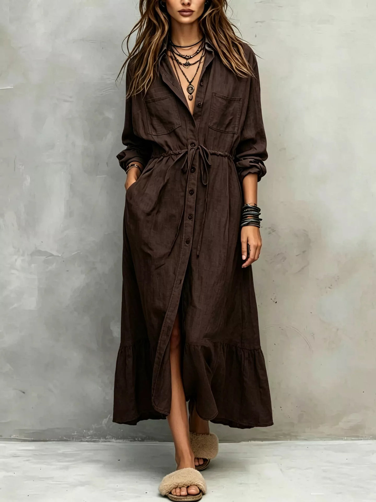 Plus size long sleeve button front shirt dress by Trendsi, featuring a relaxed fit and classic collar, displayed on a mannequin.