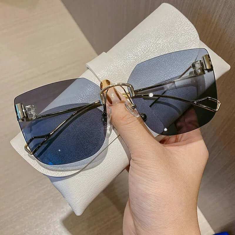 Vintage Brand Designer Sunglasses Fashion Oversized Rimless SunglassesElevate your style with our Vintage Brand Designer Sunglasses. Made with high-quality materials, these oversized rimless sunglasses offer 99% UV protection and 1.3 mSunglassesPlush Fashions ShopPlush Fashion Shop