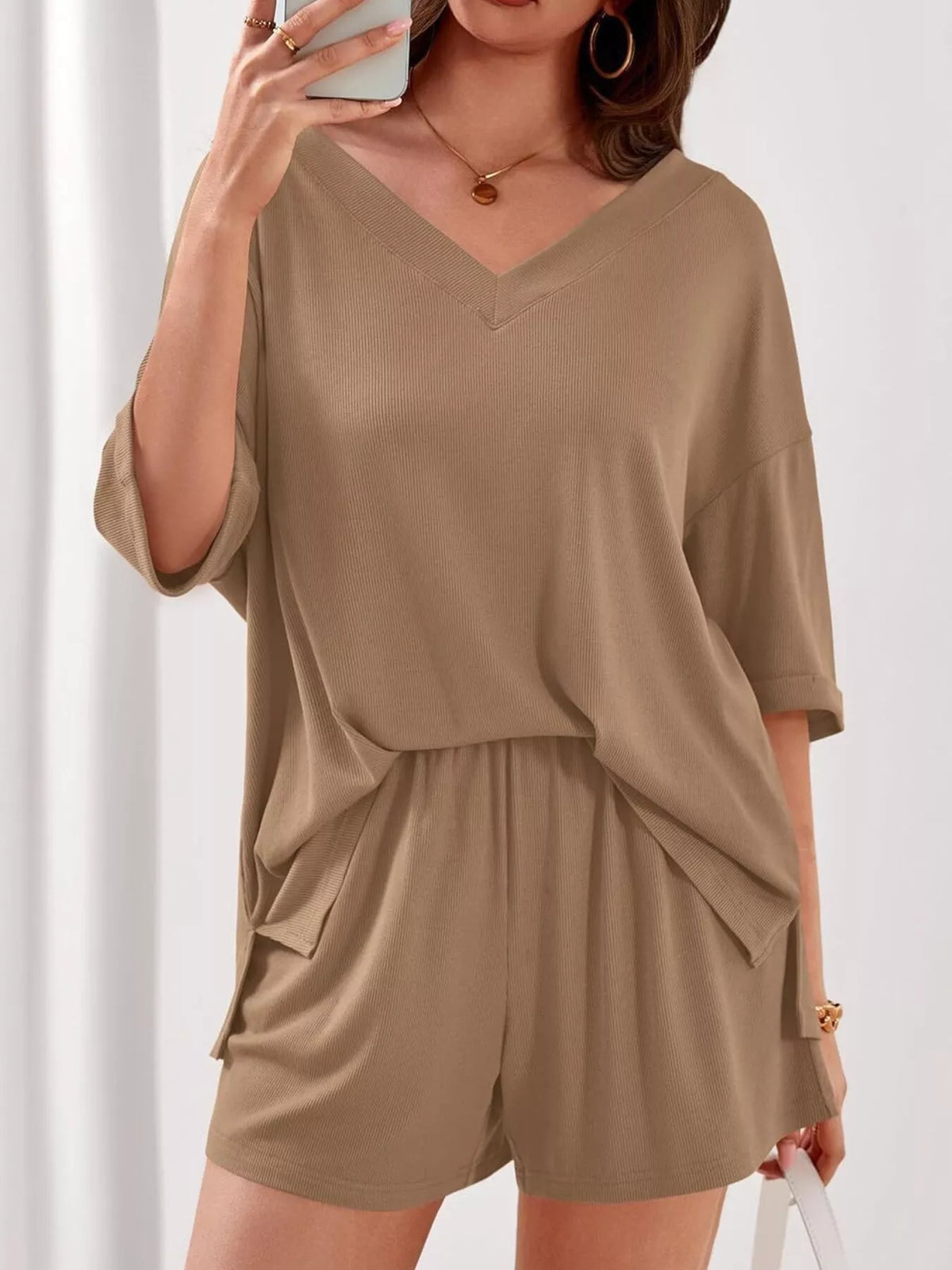Women's casual V-neck top and shorts two-piece clothing set from Plush Fashion Hub, solid color, comfortable and stylish for everyday wear.