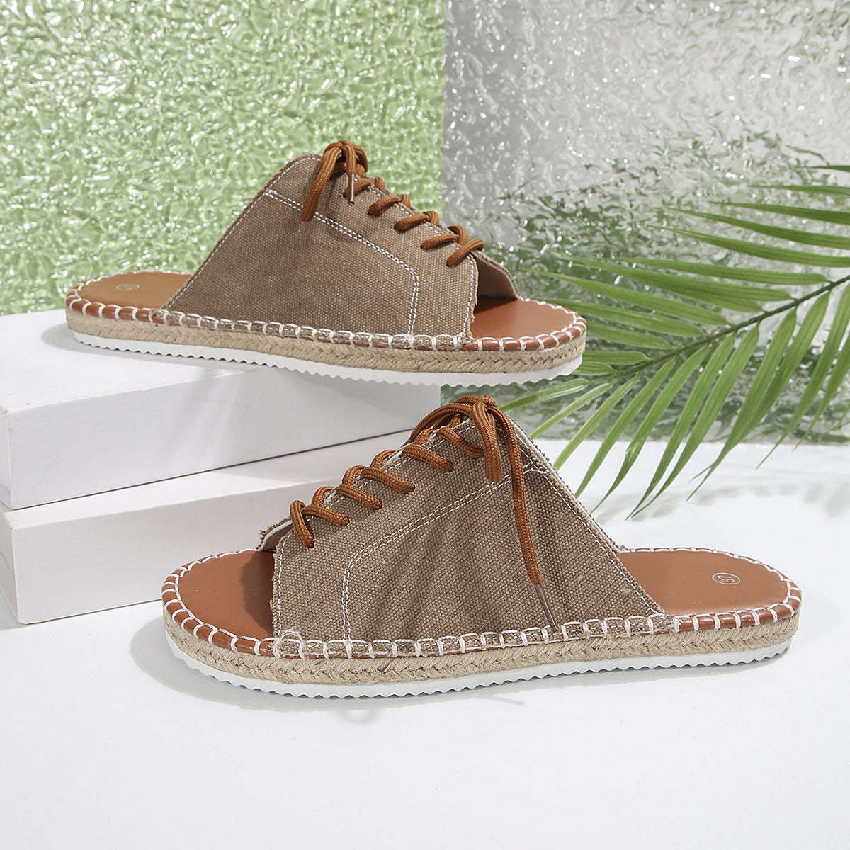 Women’s faux leather lace-up open toe flat sandals by Plush Fashion Hub, featuring stylish design and comfortable flat sole.