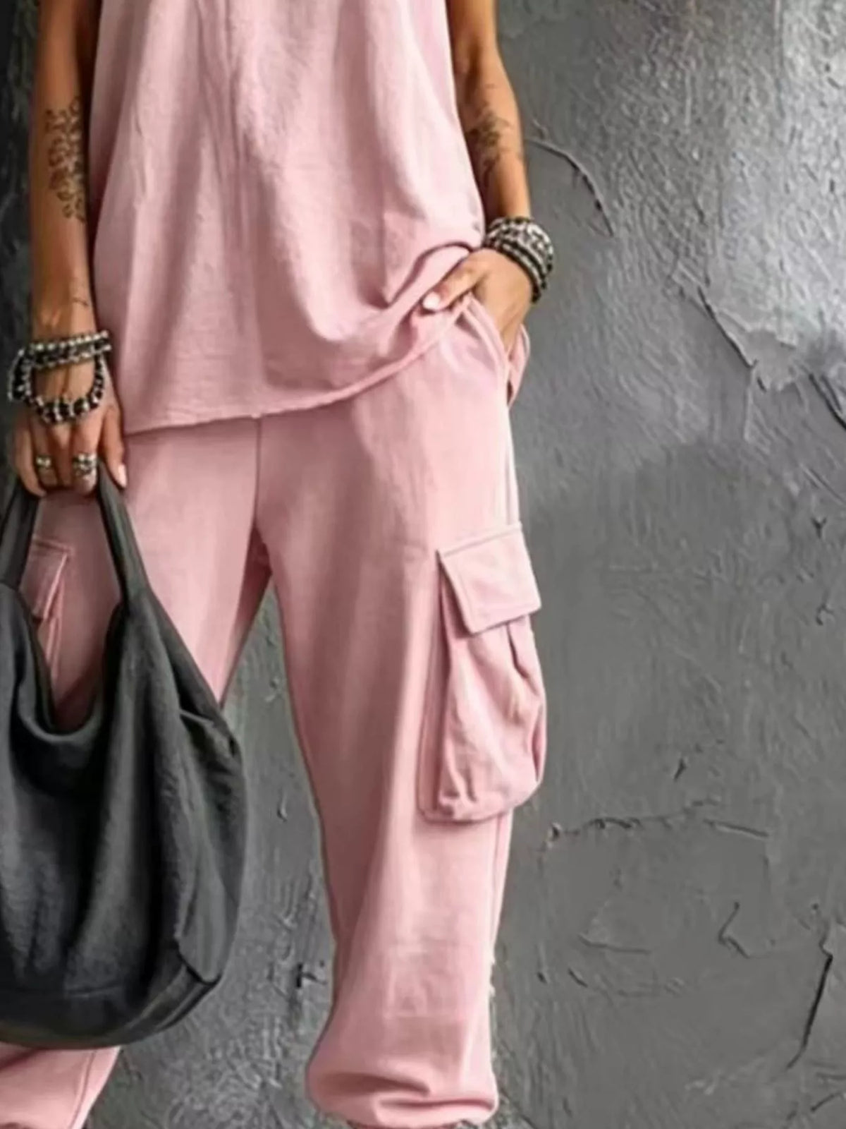 Plus size casual tank top and cargo pants set by Trendsi, featuring a comfortable sleeveless top and relaxed cargo pants.
