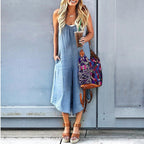 Women’s sleeveless wide-leg denim jumpsuit by FitiqueFit featuring a crew neck and casual fit, shown on a model.
