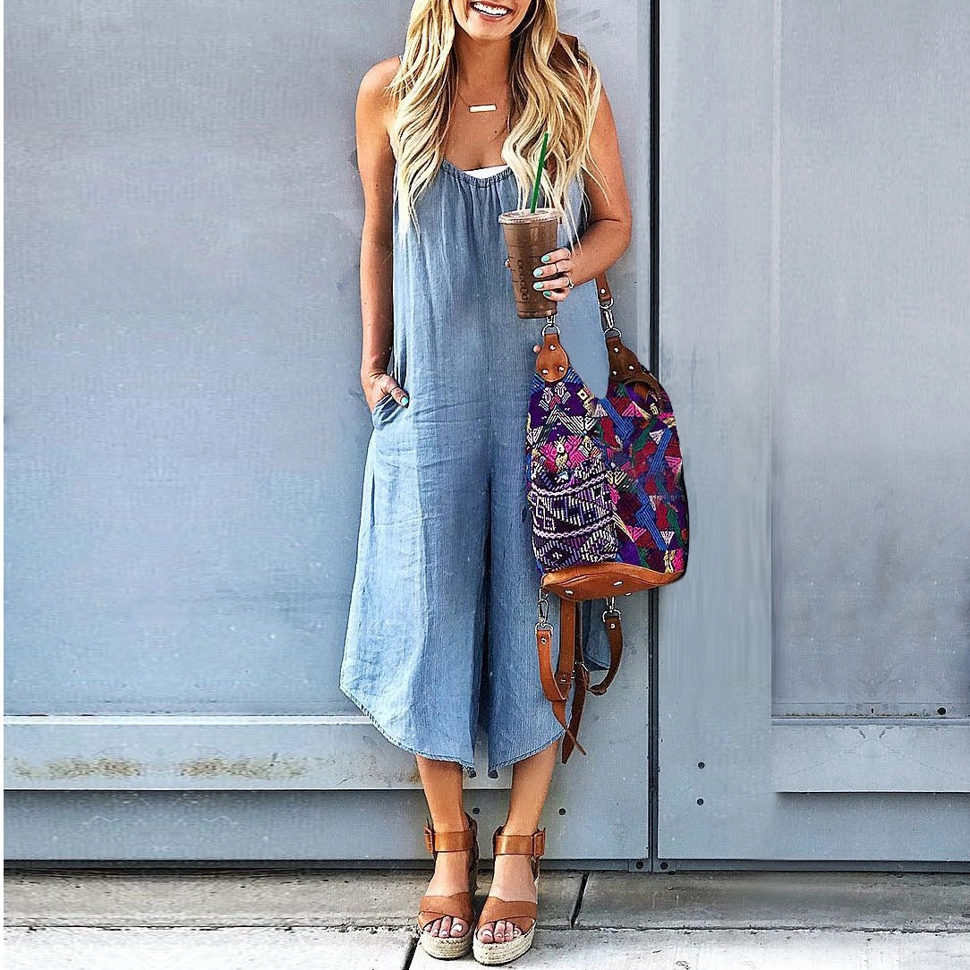 Women’s sleeveless wide-leg denim jumpsuit by FitiqueFit featuring a crew neck and casual fit, shown on a model.
