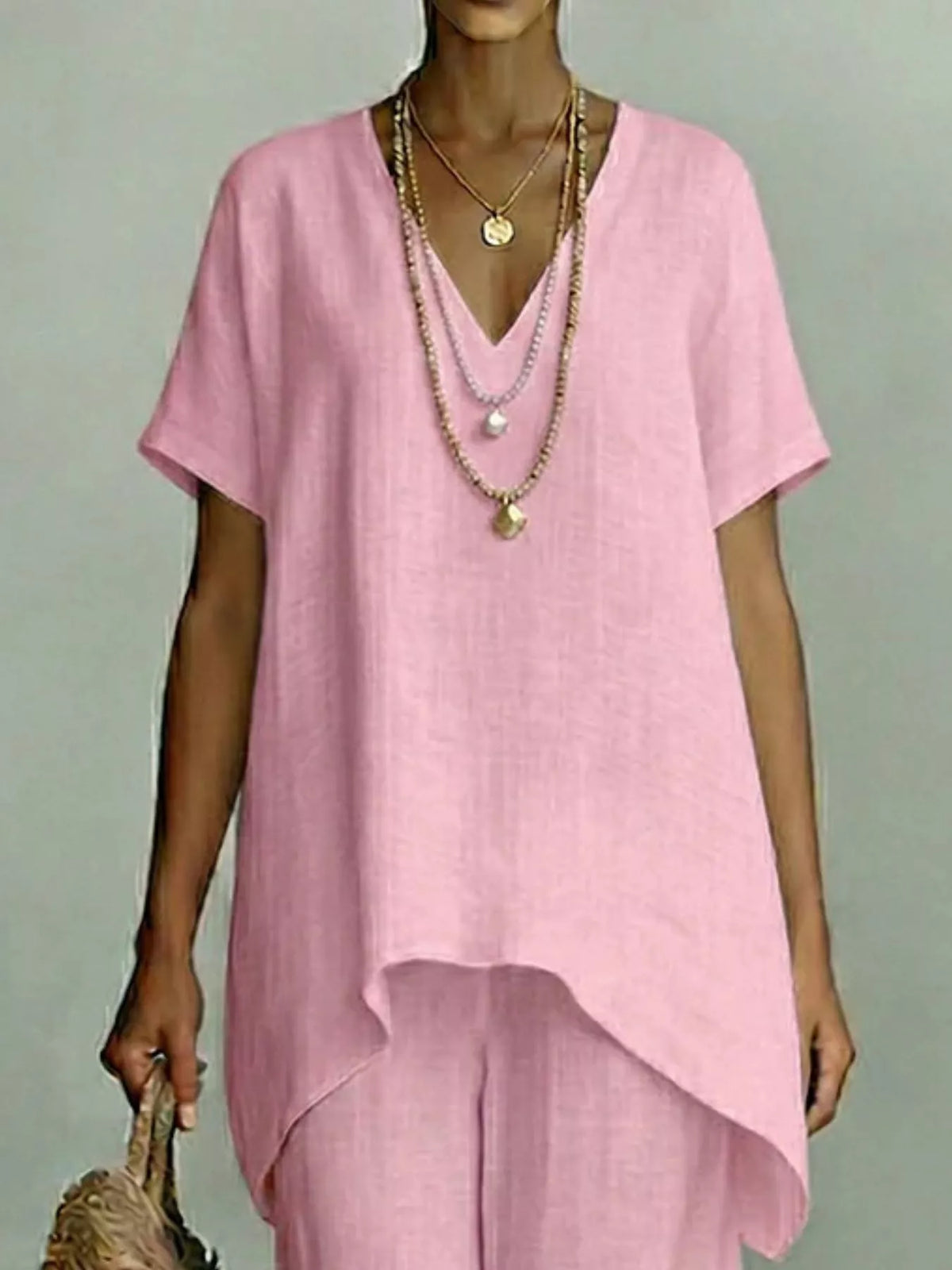 Plus size V-neck top and wide-leg pants set by Plush Fashion Hub, featuring a stylish two-piece outfit in full size.
