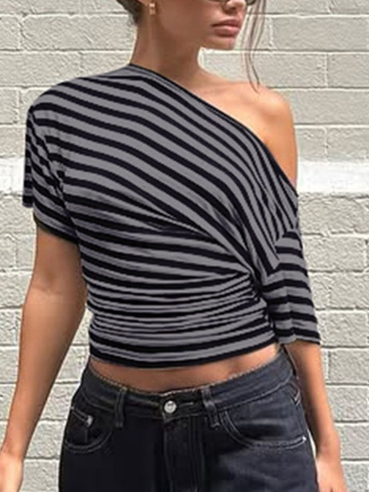 Women’s asymmetrical striped one-shoulder T-shirt from Plush Fashion Hub, featuring a stylish design and modern fit.
