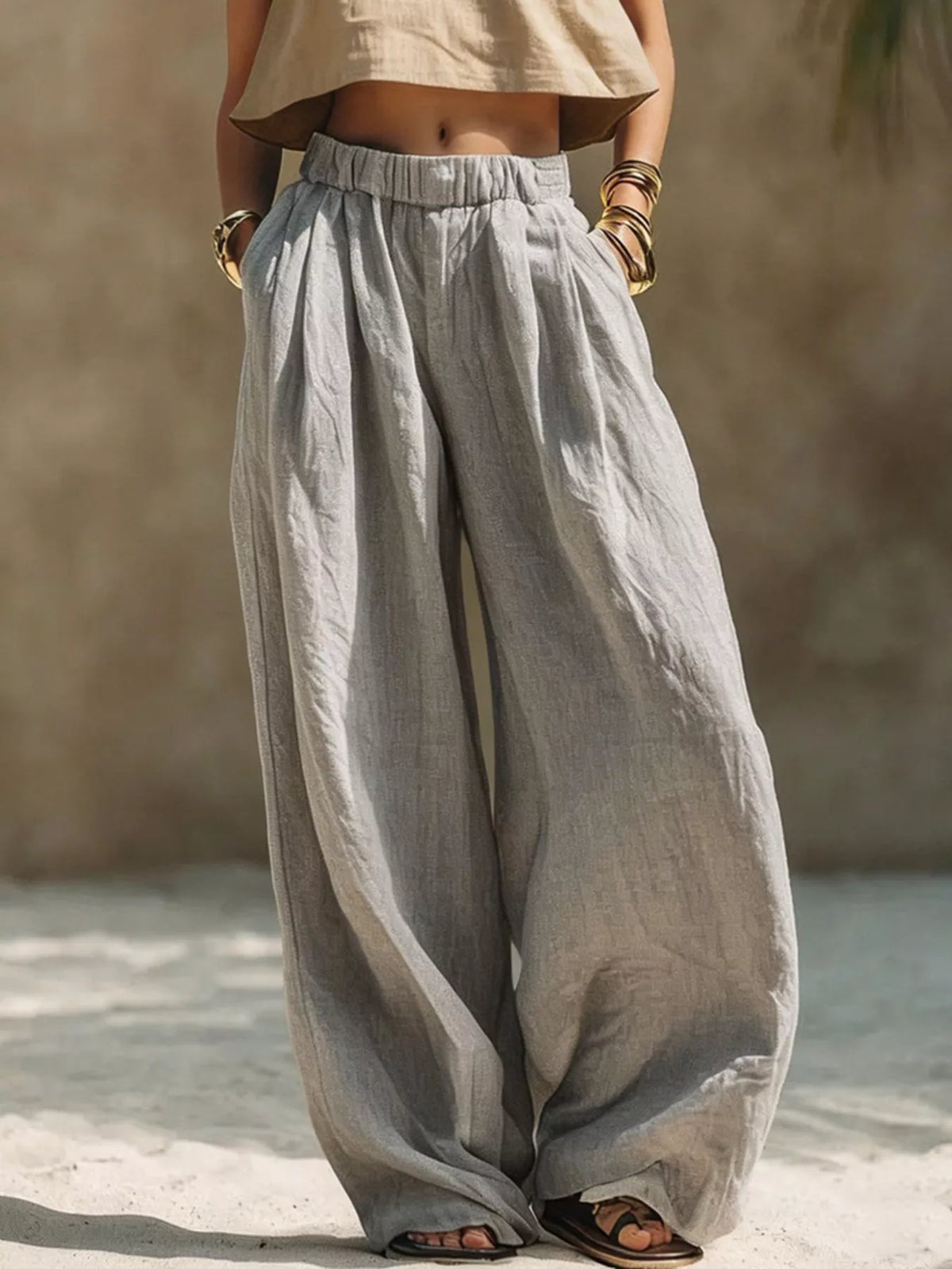 Plus size wide-leg pants with full elastic waistband by Trendsi, showcasing comfortable and stylish flowy pant design.