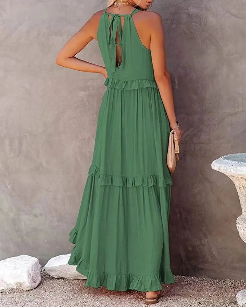 Elegant apricot ruffle maxi dress by FitiqueFit, featuring flowing fabric and stylish ruffle details for casual wear.