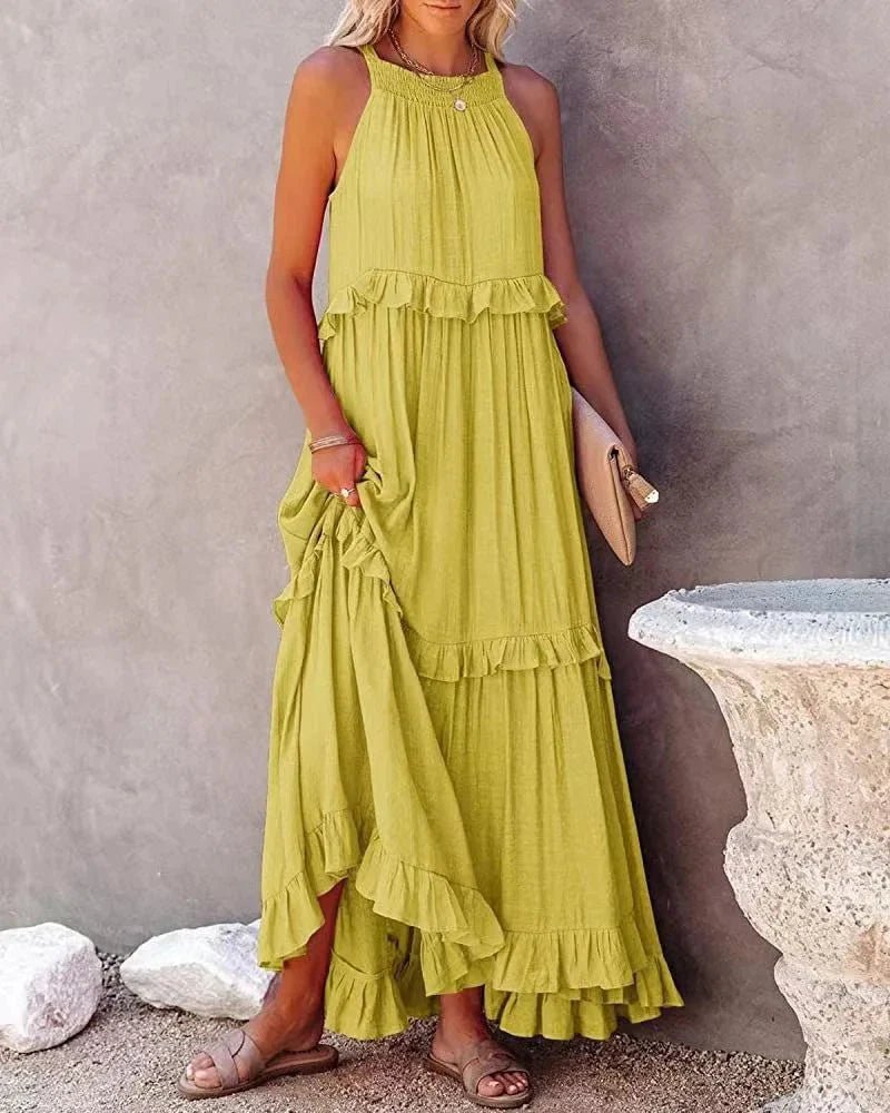 Elegant apricot ruffle maxi dress by FitiqueFit, featuring flowing fabric and stylish ruffle details for casual wear.