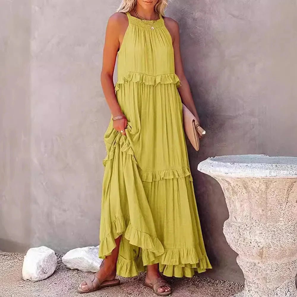 Elegant apricot ruffle maxi dress by FitiqueFit, featuring flowing fabric and stylish ruffle details for casual wear.