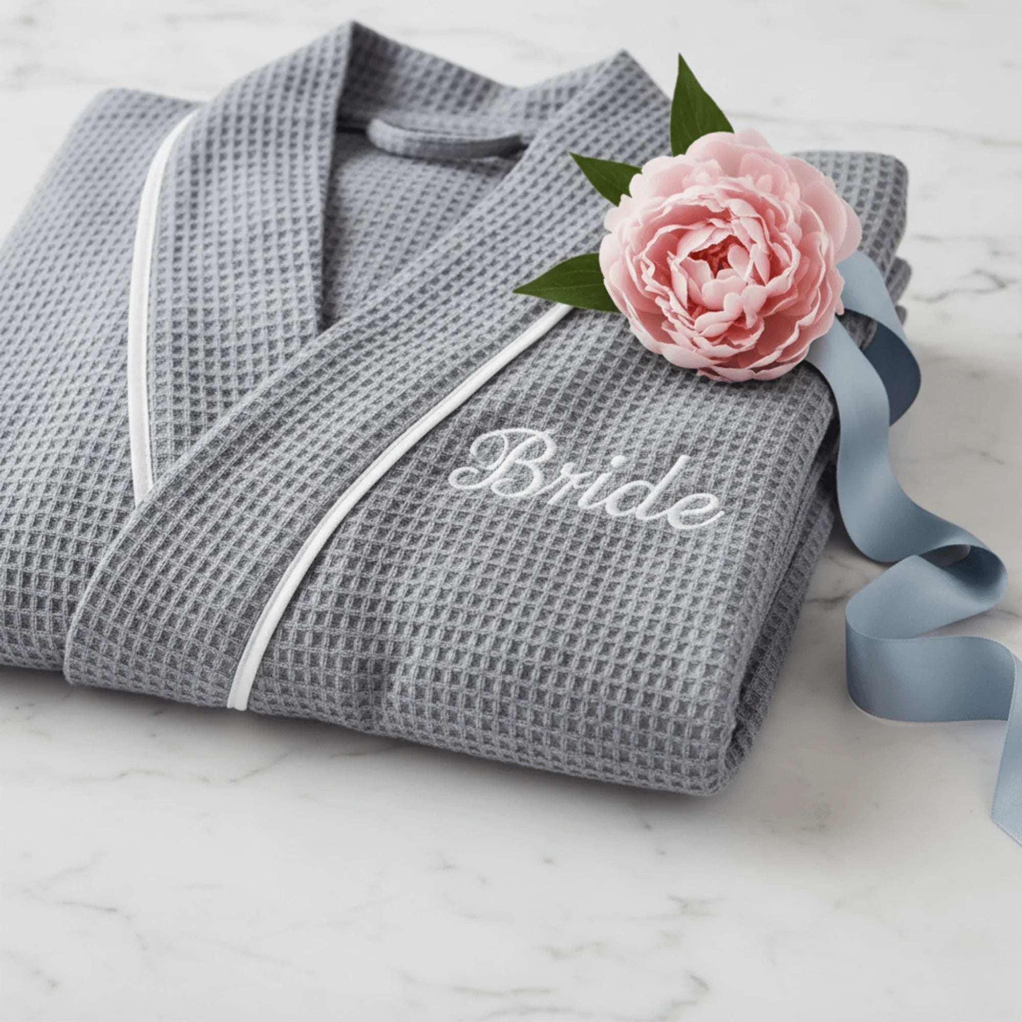 Lotus Linen women's knee-length waffle robe with embroidered details, soft and cozy for comfortable lounging.