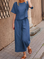 European and American women's linen casual two-piece suit with a loose fit, featuring a solid color top and matching bottoms.