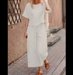 European and American women's linen casual two-piece suit, featuring a loose-fit solid color top and matching bottoms.