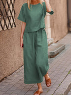 European and American women's linen casual two-piece suit featuring a loose fit and solid color, perfect for comfortable everyday wear.