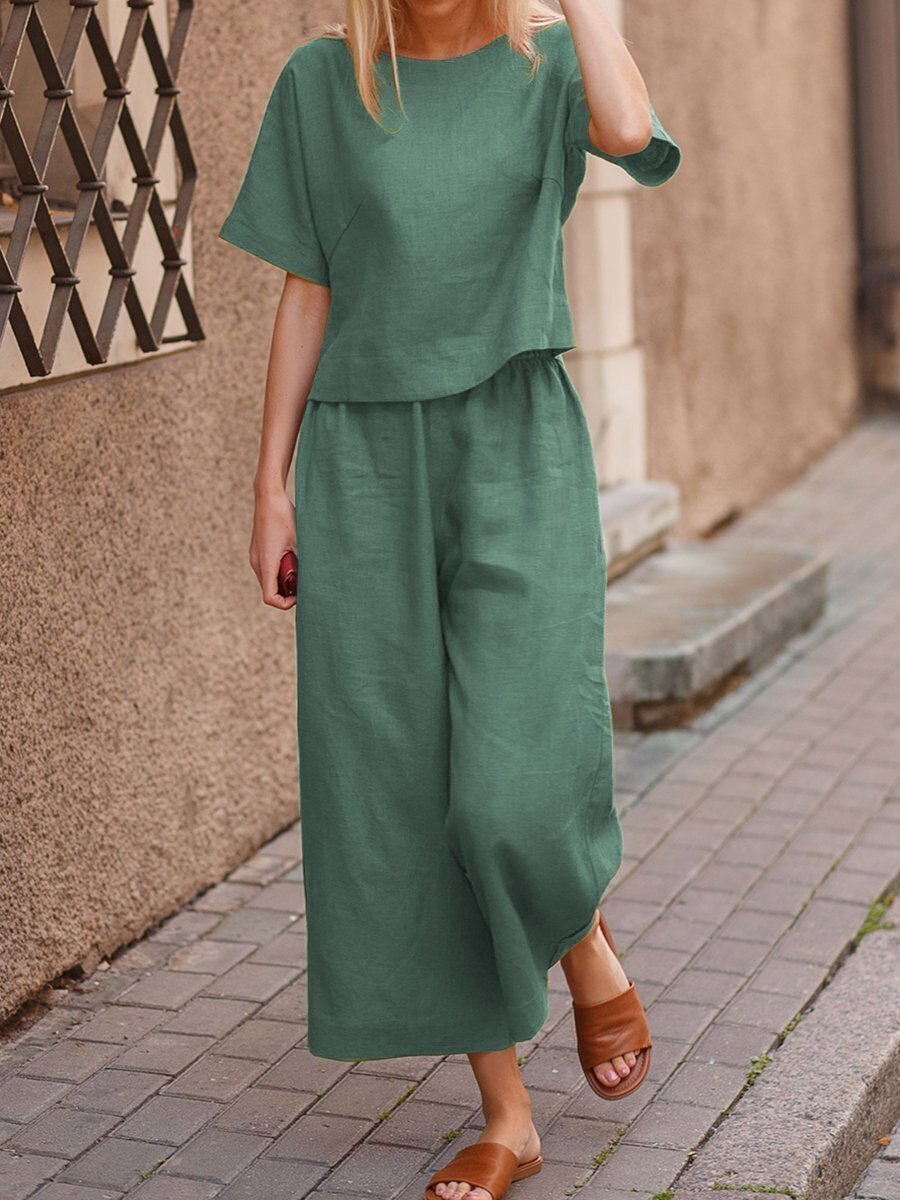 European and American women's linen casual two-piece suit featuring a loose fit and solid color, perfect for comfortable everyday wear.