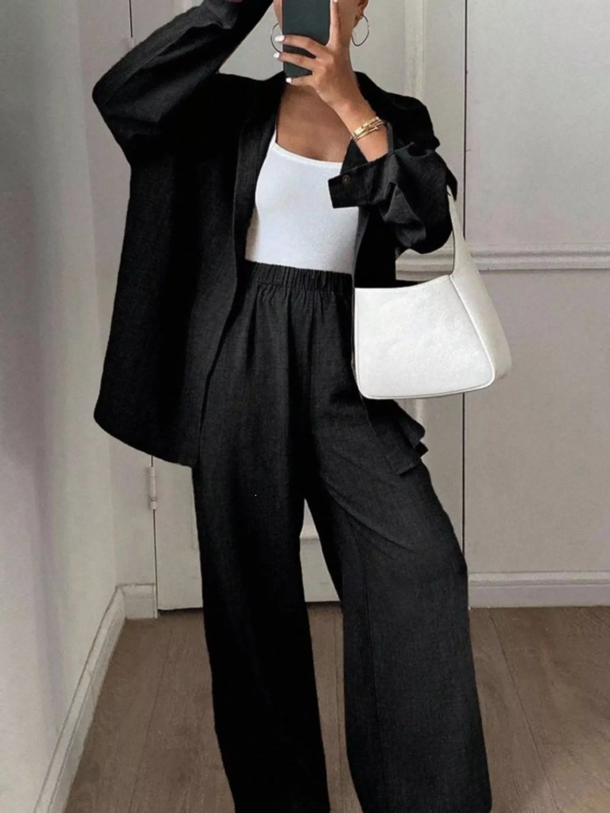 Trendsi long sleeve button-up shirt and wide-leg pants set, stylish casual outfit, featuring a crisp shirt and flowing pants.