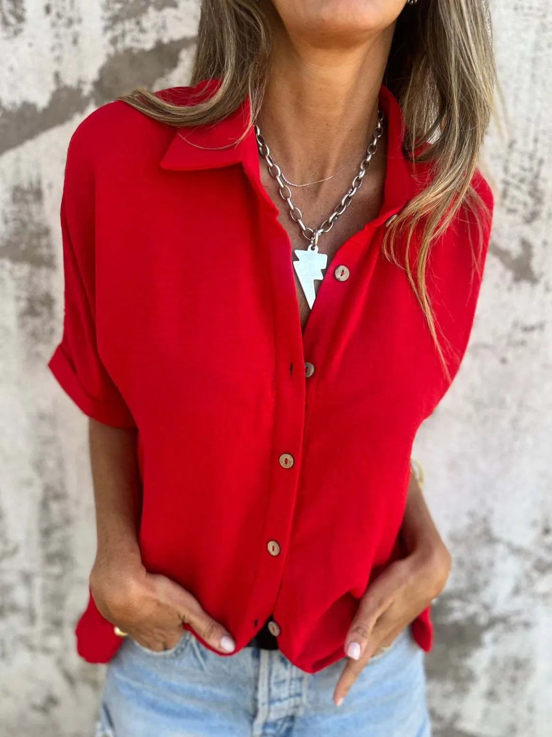 Women's collared button-down office blouse from Plush Fashion Hub, featuring half sleeves and a tailored fit.
