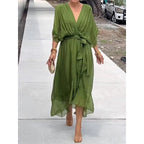 Plush Fashion Hub batwing sleeve V-neck midi dress with tied irregular hem, flowing fairy-style dress in lightweight fabric.